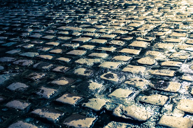 Wet cobblestone street in Europe